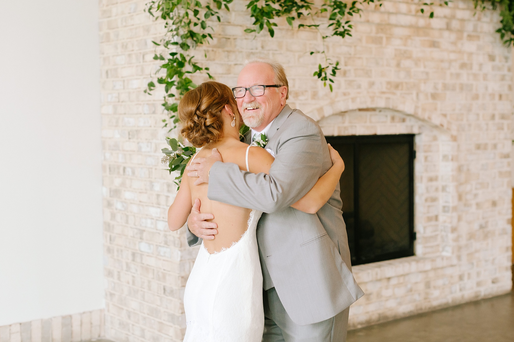 bride hugs dad during first look at Wrightsville Manor