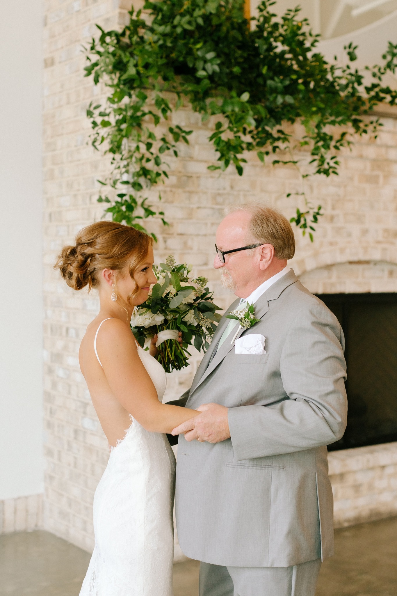 bride and dad hug after first look