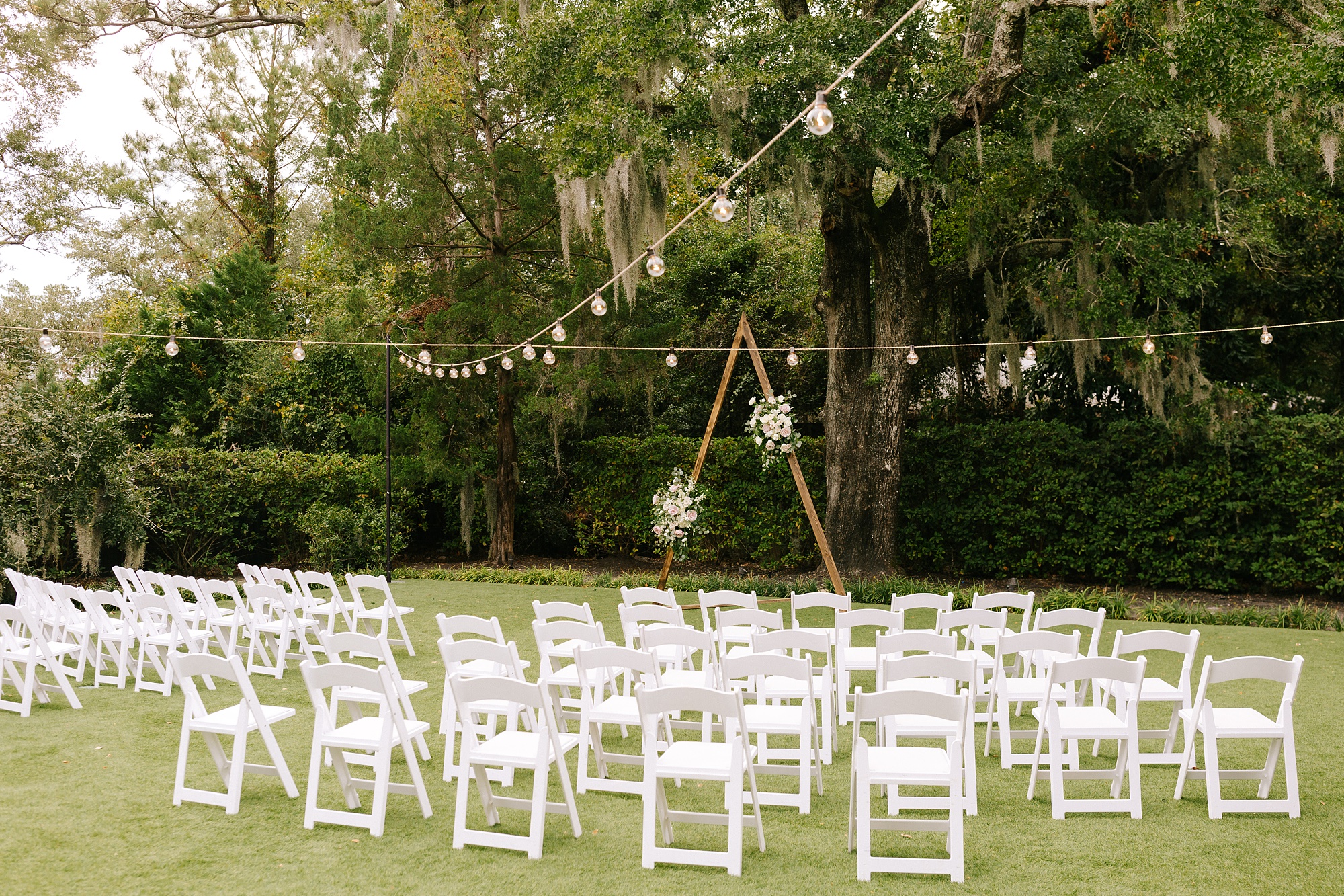 wedding ceremony in gardens of Wrightsville Manor with modern altar 
