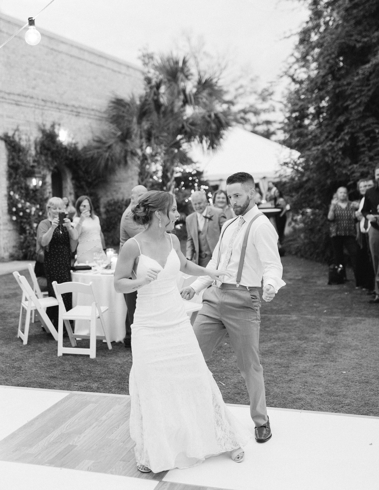 bride and groom dance during garden wedding reception