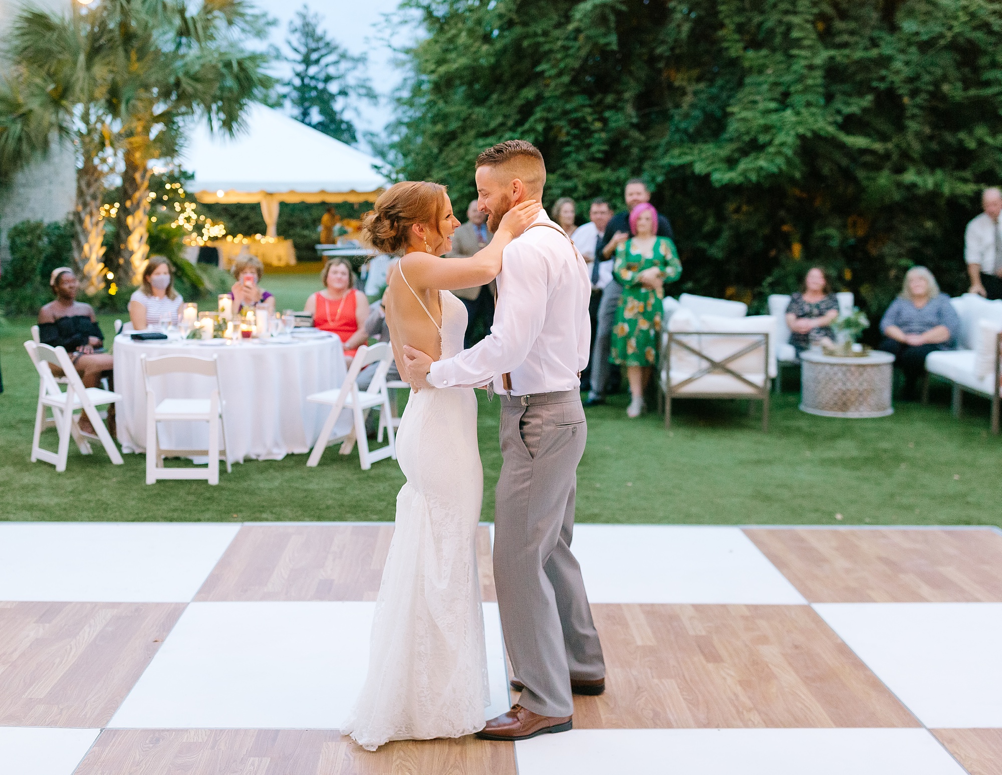 bride and groom dance during garden wedding reception