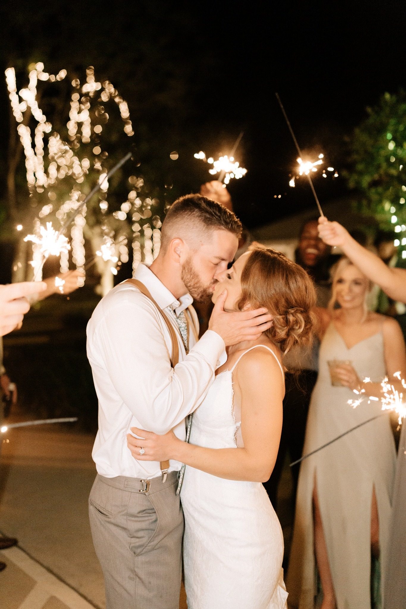 bride and groom kiss during Wilmington NC wedding reception
