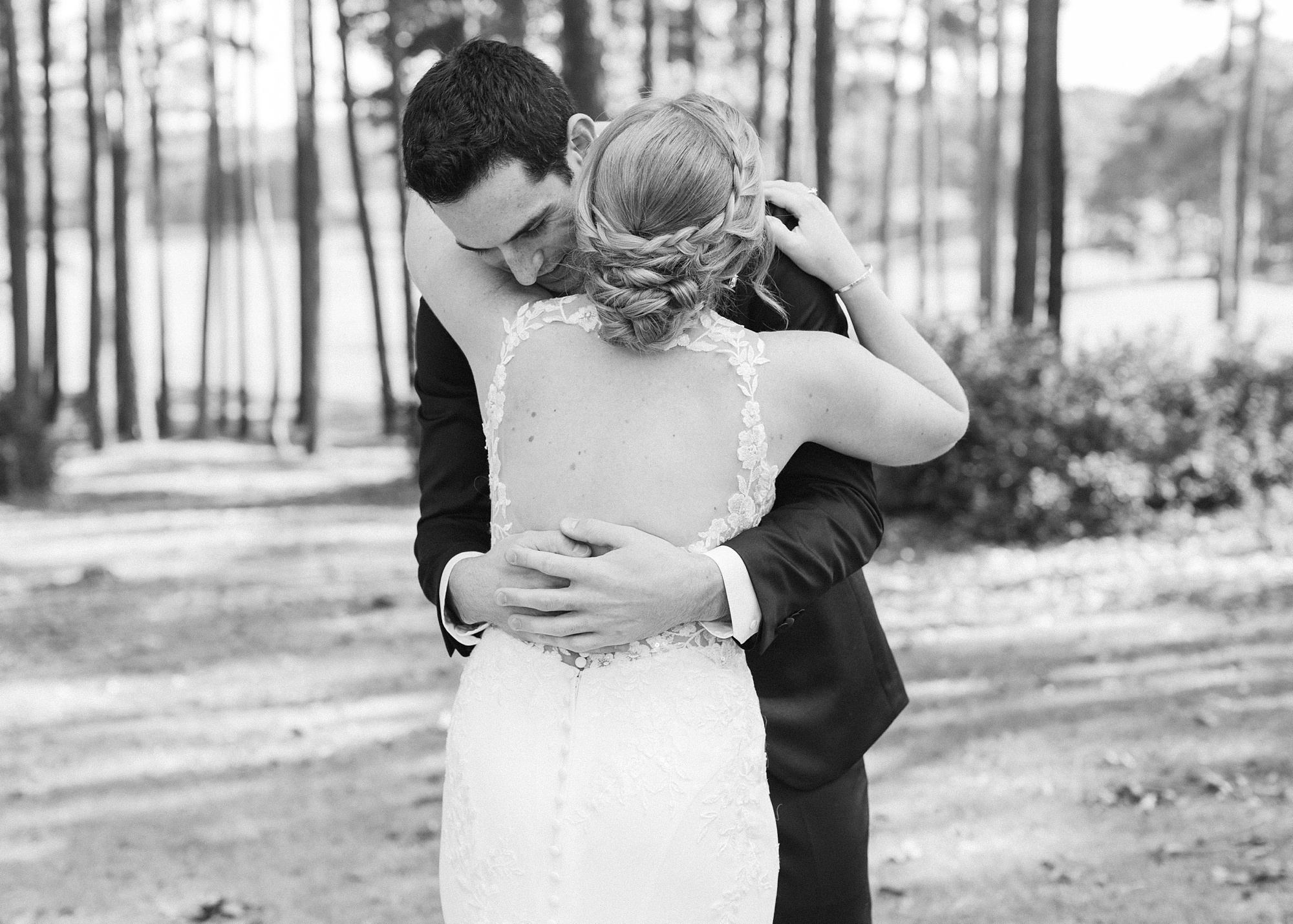 bride and groom hug during first look in Birmingham AL