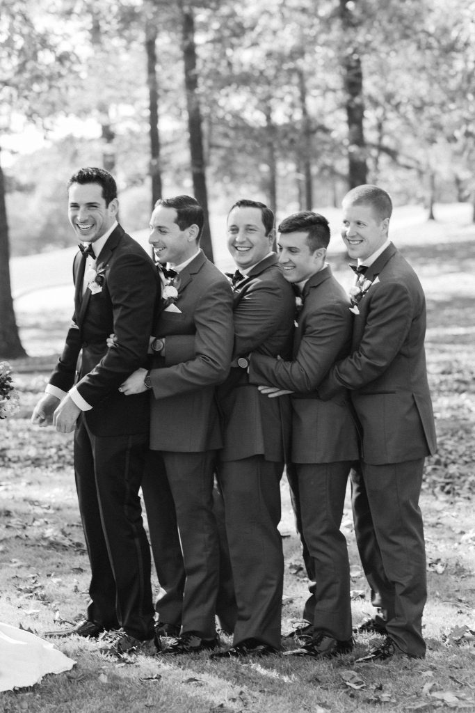 groomsmen stand together during photos at Renaissance Ross Bridge
