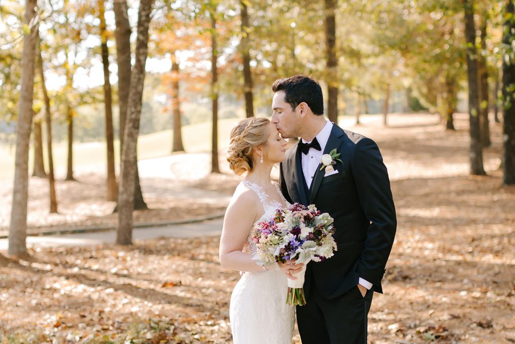 groom kisses bride's forehead in Alabama