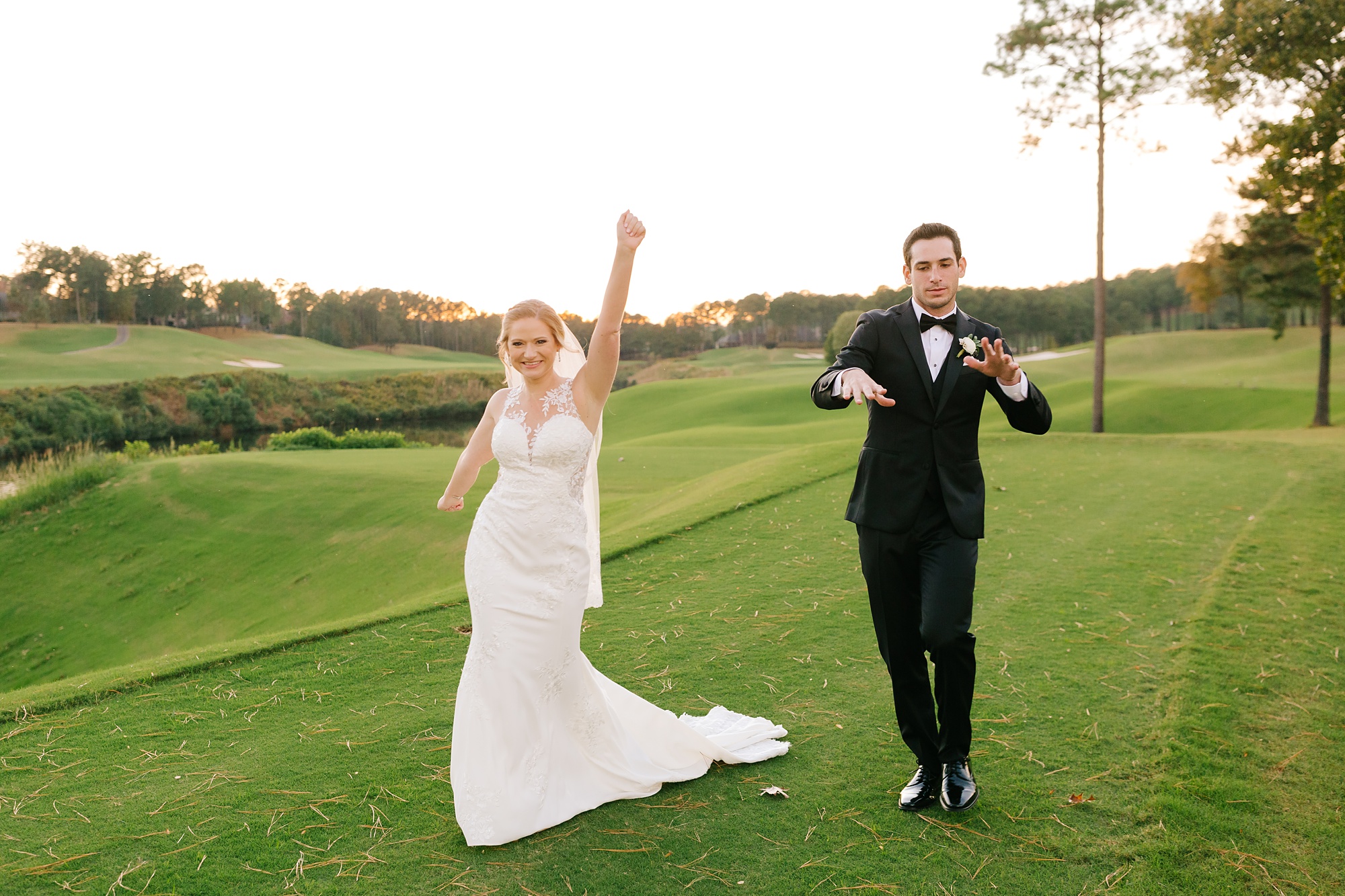 newlyweds cheer during wedding photos in Alabama