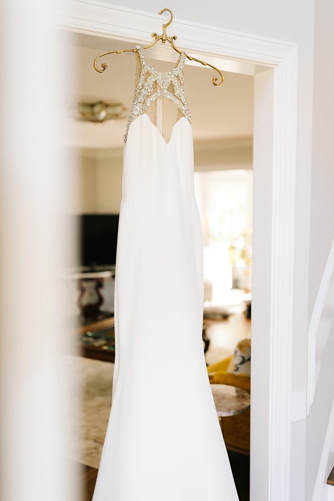 wedding gown hangs in bridal suite at The Meadows Raleigh
