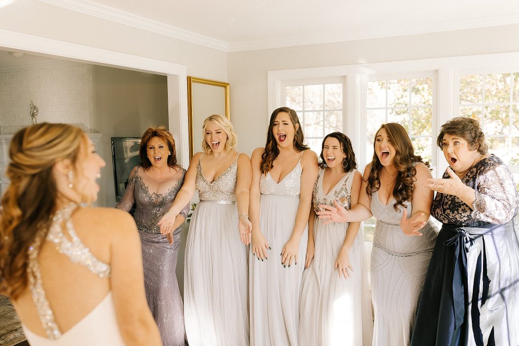 bridesmaids reaction to bride in gown