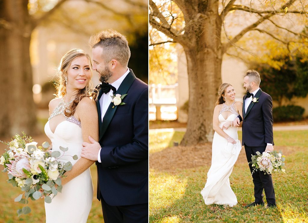 bride in chic modern wedding gown poses with groom in tux