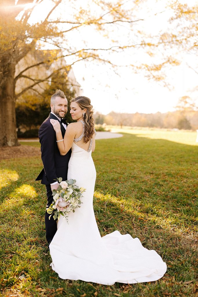 brie and groom pose in Raleigh NC