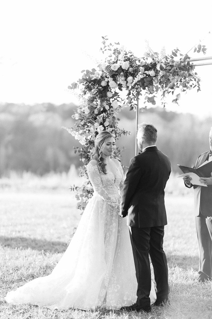 bride and groom exchange vows during wedding ceremony in Raleigh NC