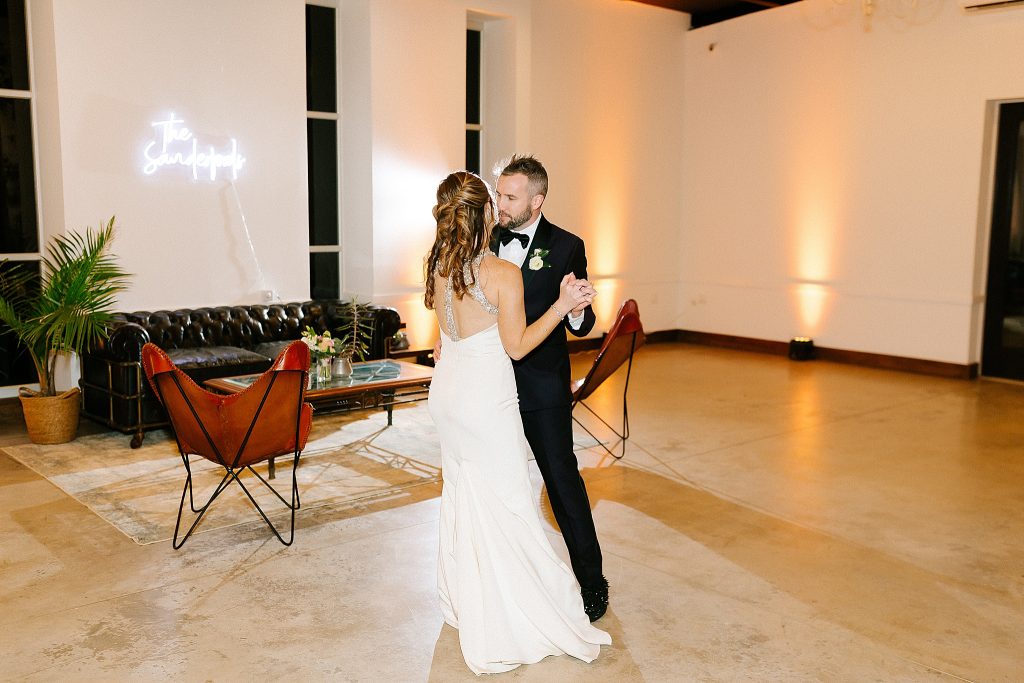 newlyweds dance together during reception at The Meadows Raleigh