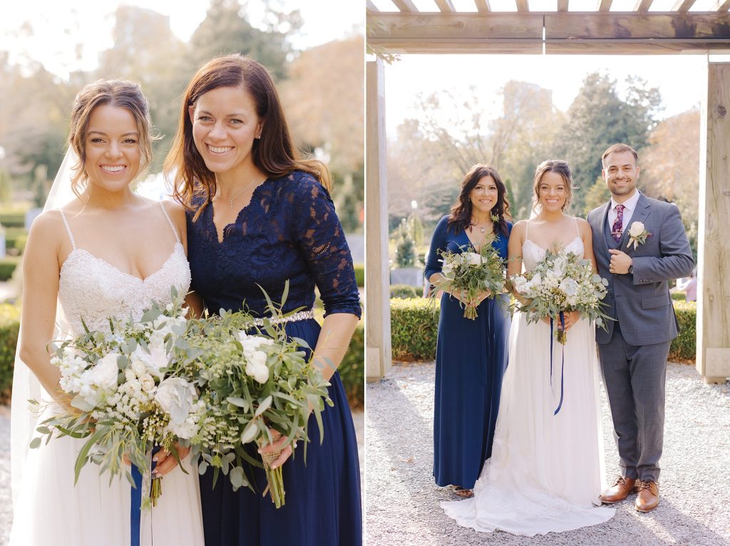 bride poses with bridesmaids in navy blue gowns