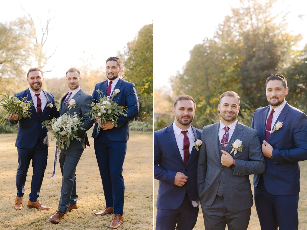 groomsmen hold bouquets from bridesmaids posing with groom
