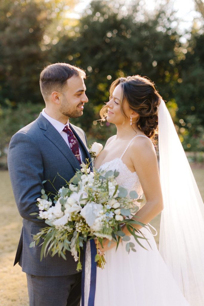 Atlanta couple smiles at each other during photos