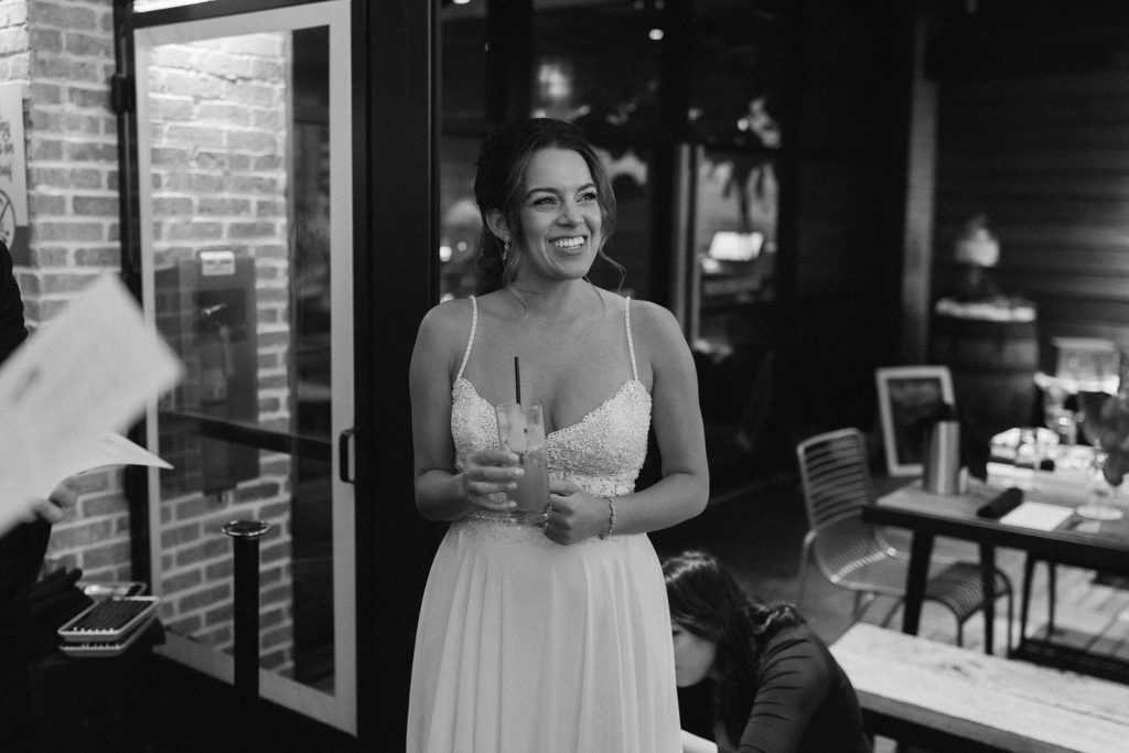 bride smiles during wedding reception in Downtown Atlanta