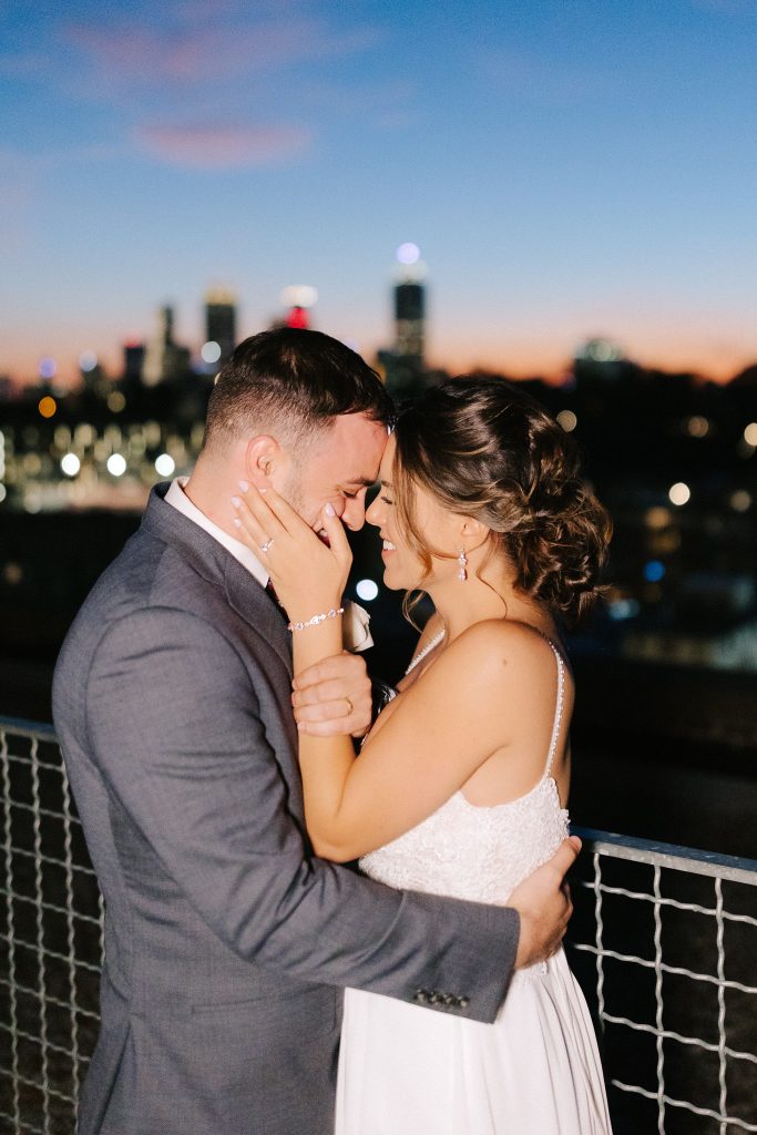 nighttime wedding portraits overlooking Downtown Atlanta at sunset