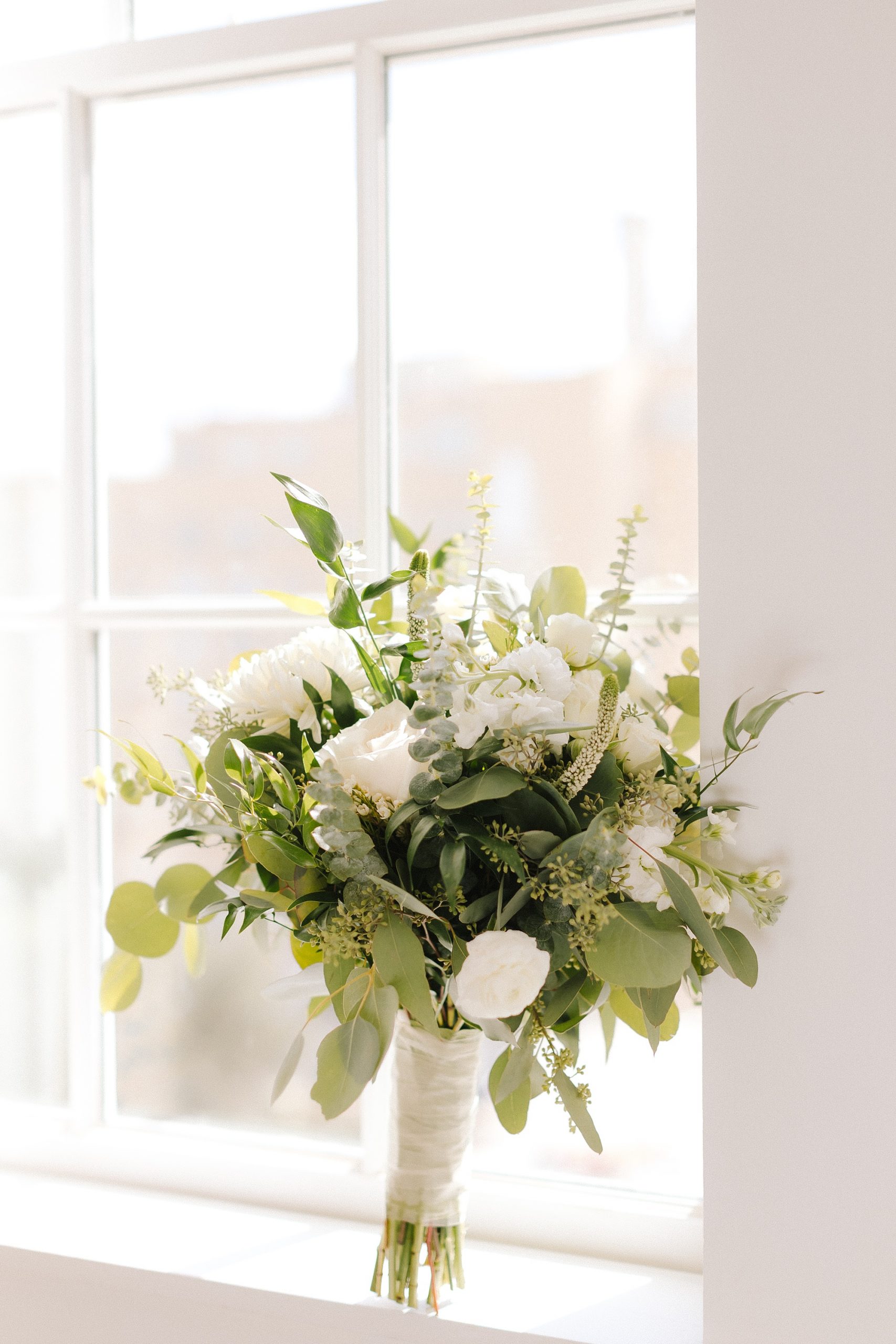 wedding bouquet sits in window sill at Lakeland hotel