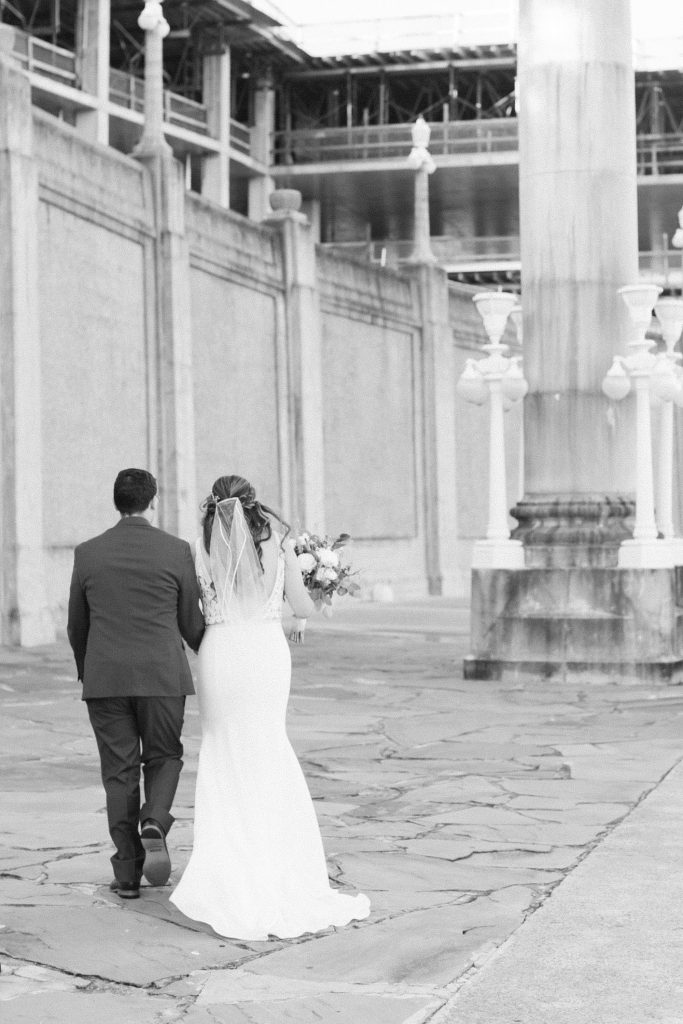 newlyweds walk away from ceremony in Downtown Lakeland