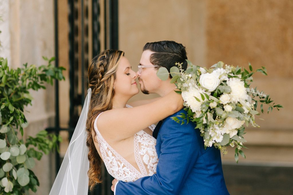 newlyweds stand nose to nose