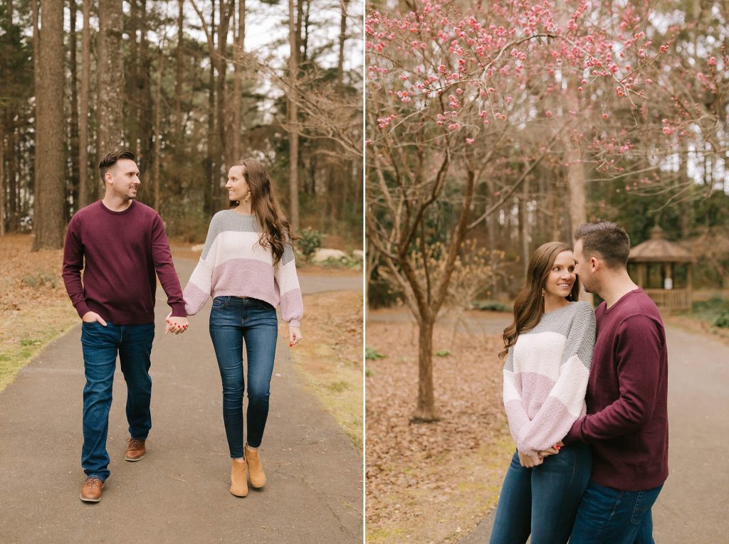couple walks through path during fall engagement session in NC