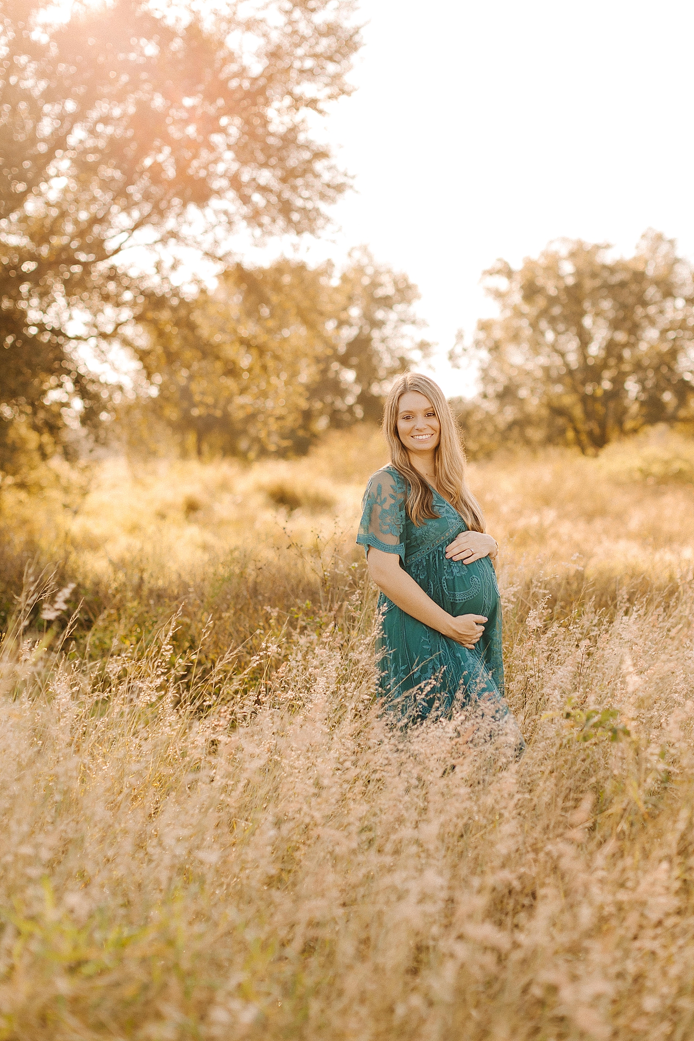 sunset Winston Salem maternity photos in field with mom in teal gown