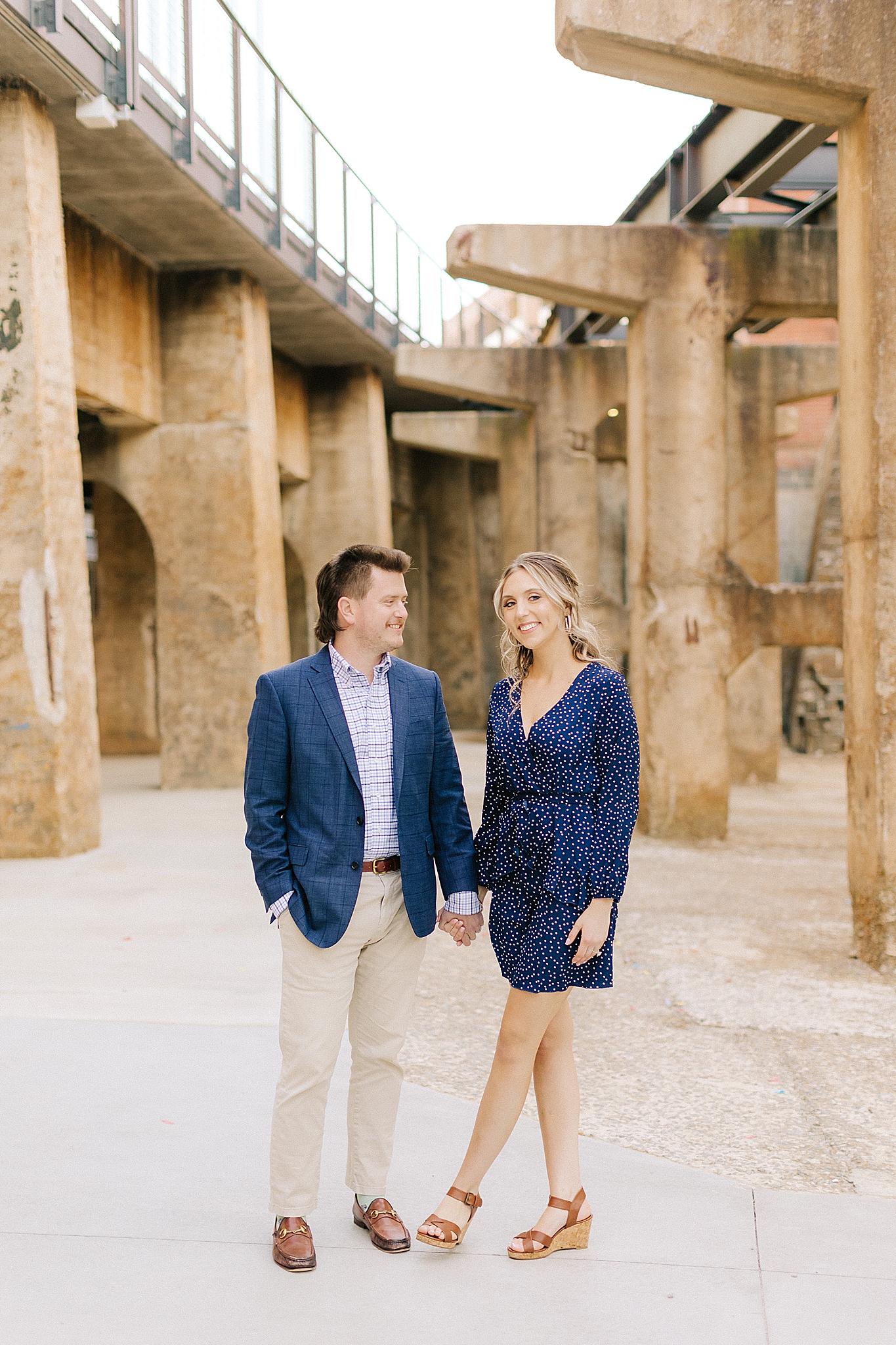 Downtown Winston Salem engagement photos with couple in navy blue