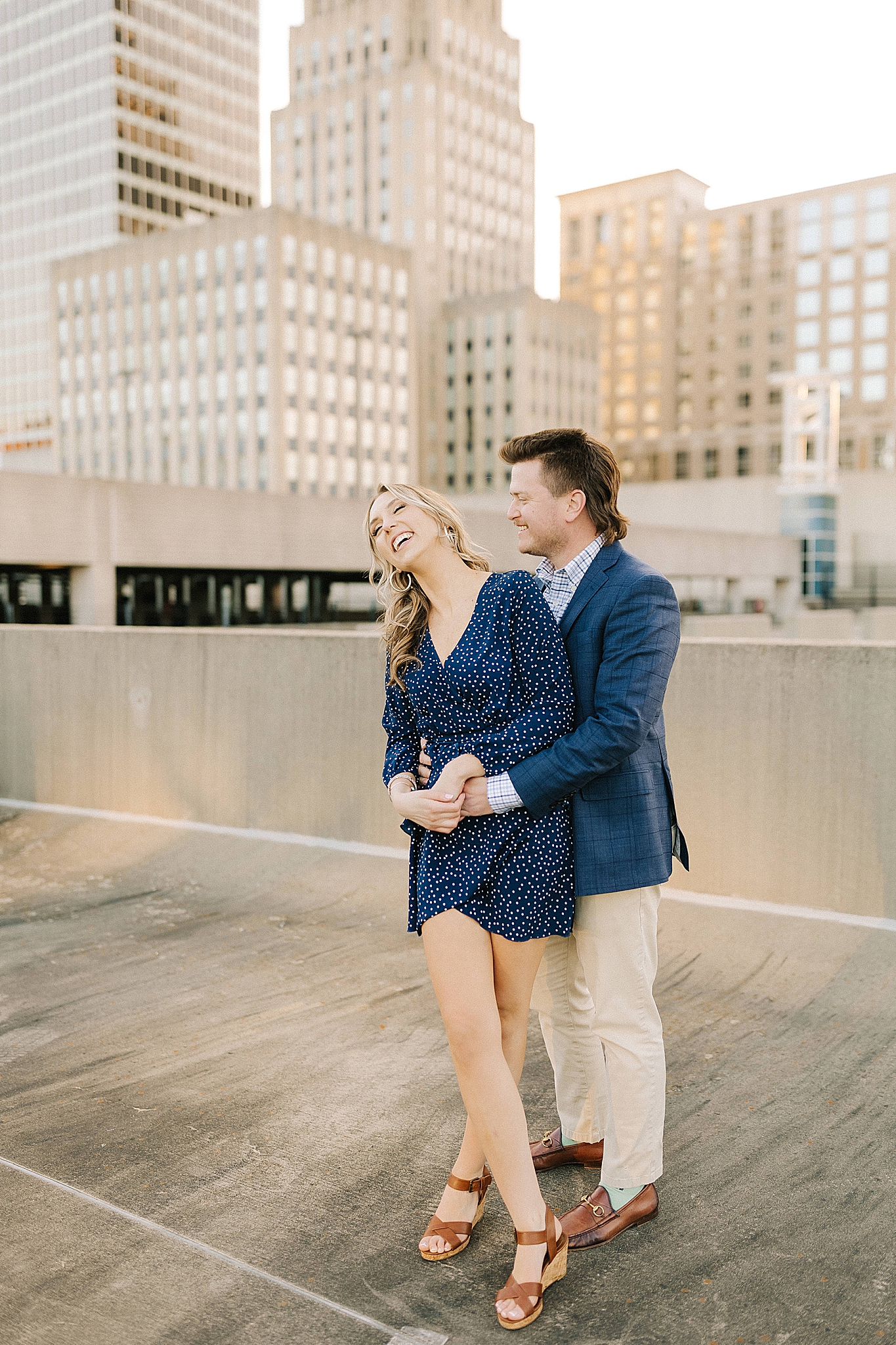 bride laughs during sunset Downtown Winston Salem engagement session