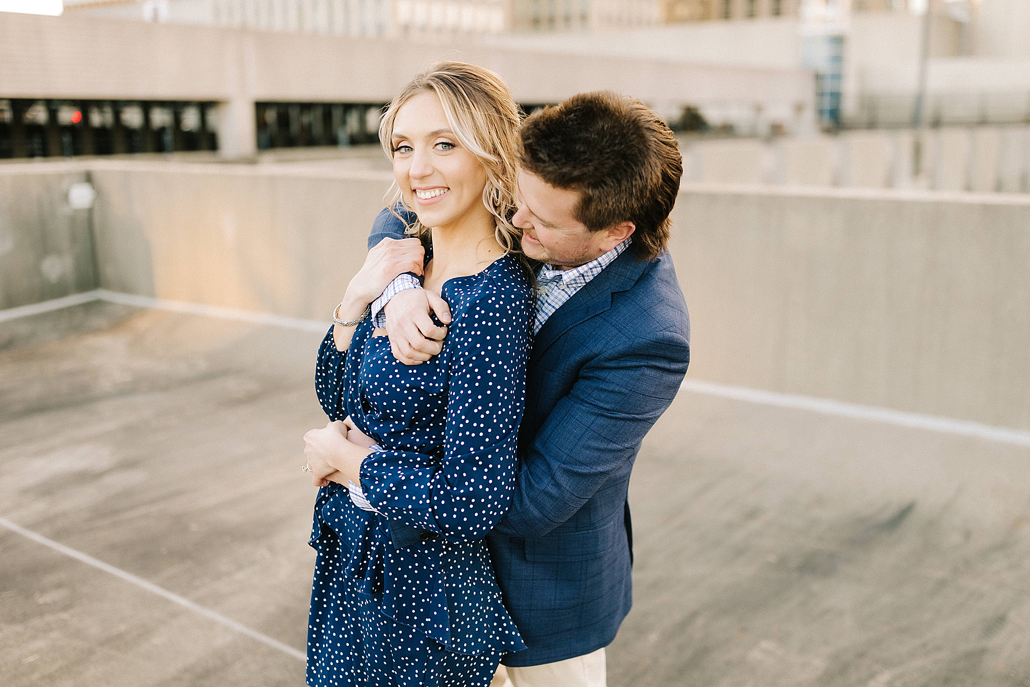 groom hugs bride from behind during NC engagement photos