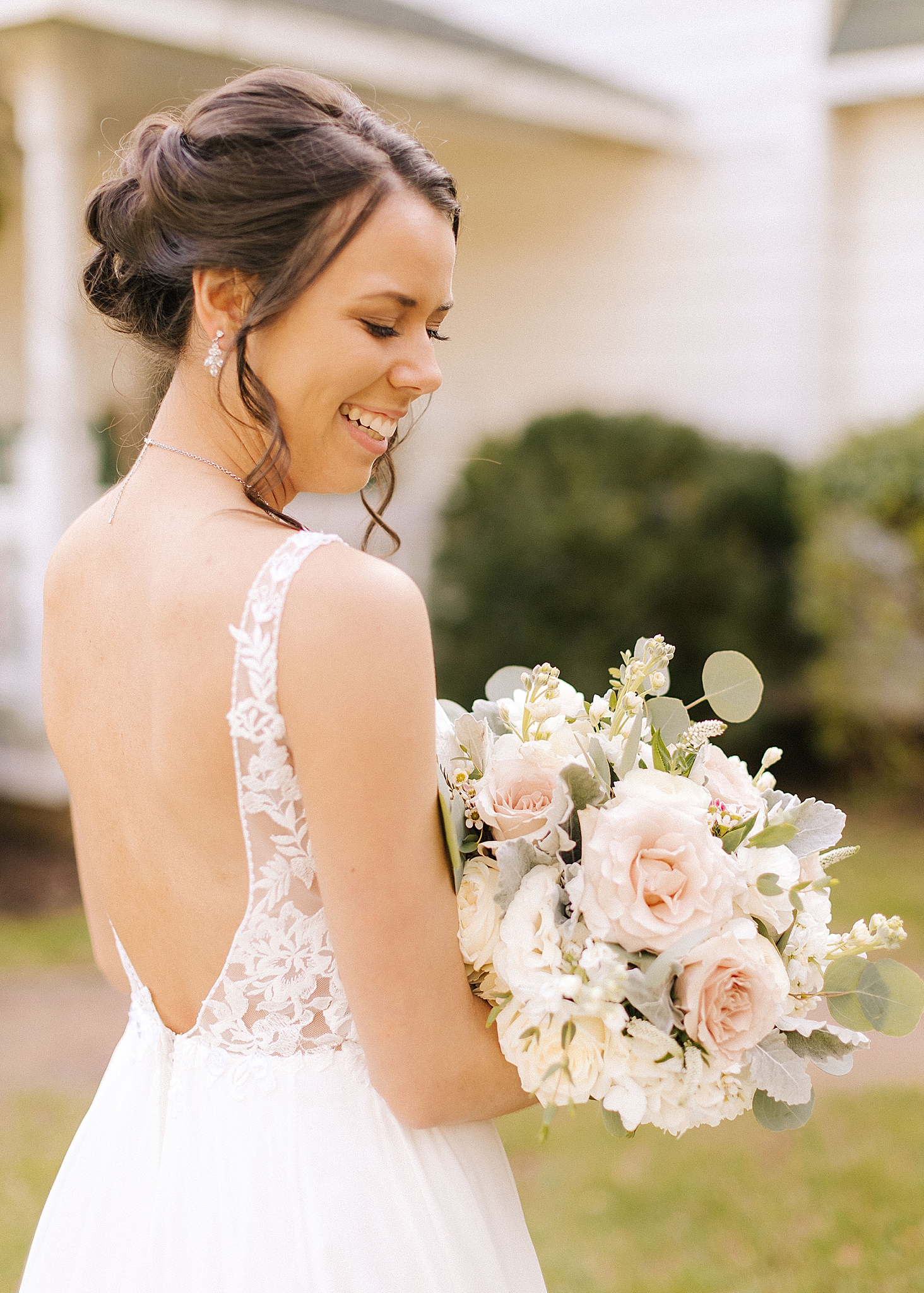 bride holds pastel bouquet during spring wedding portraits in Richmond VA