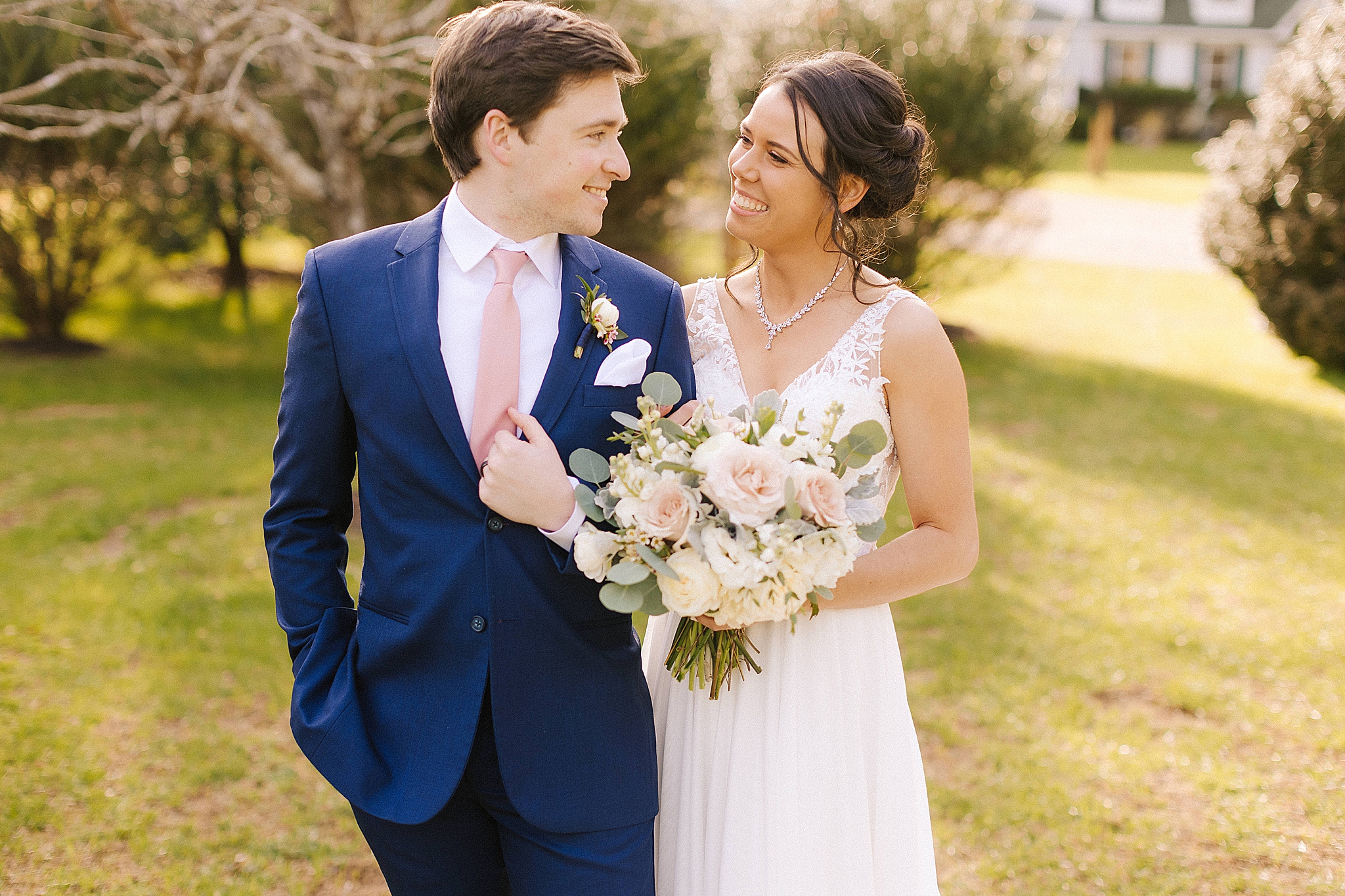 newlyweds smile at each other at Historic Jasmine Manor