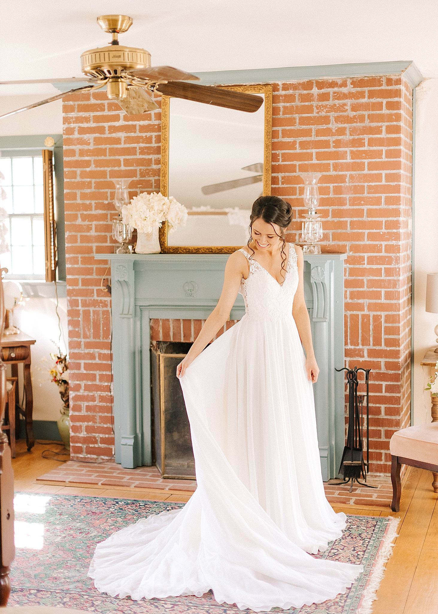 bride looks at wedding dress at Historic Jasmine Manor