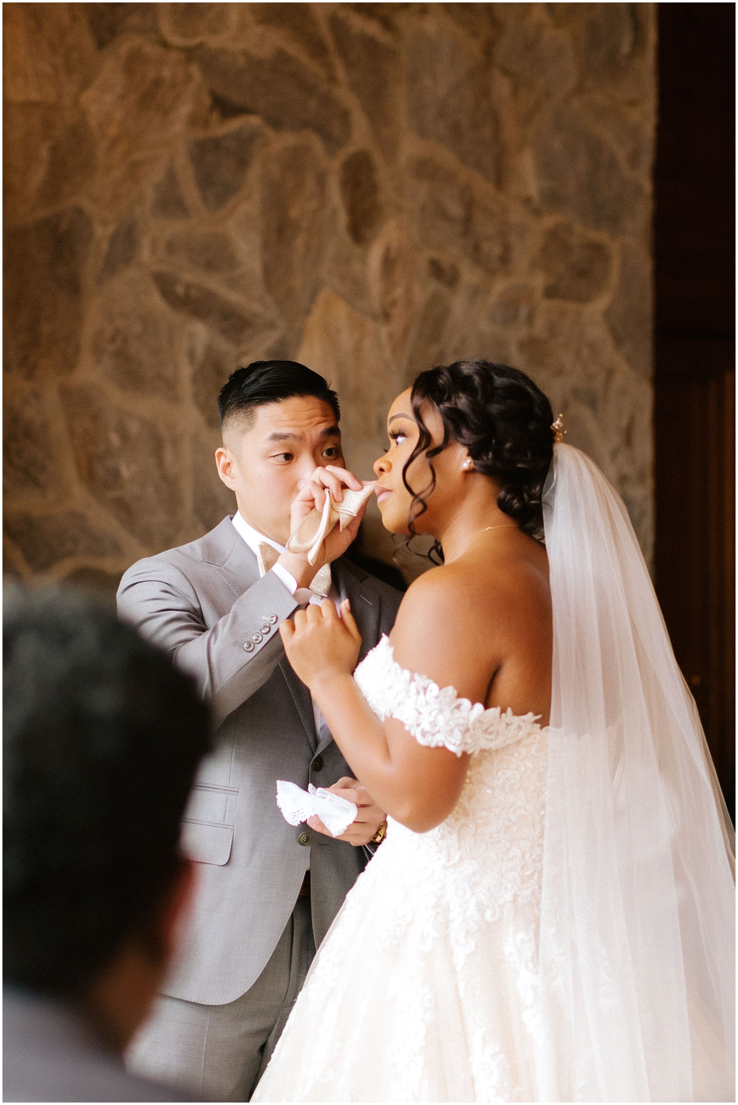 Groom wipes away tear for bride at Raleigh Wedding with NC Wedding Photographer Chelsea Renay