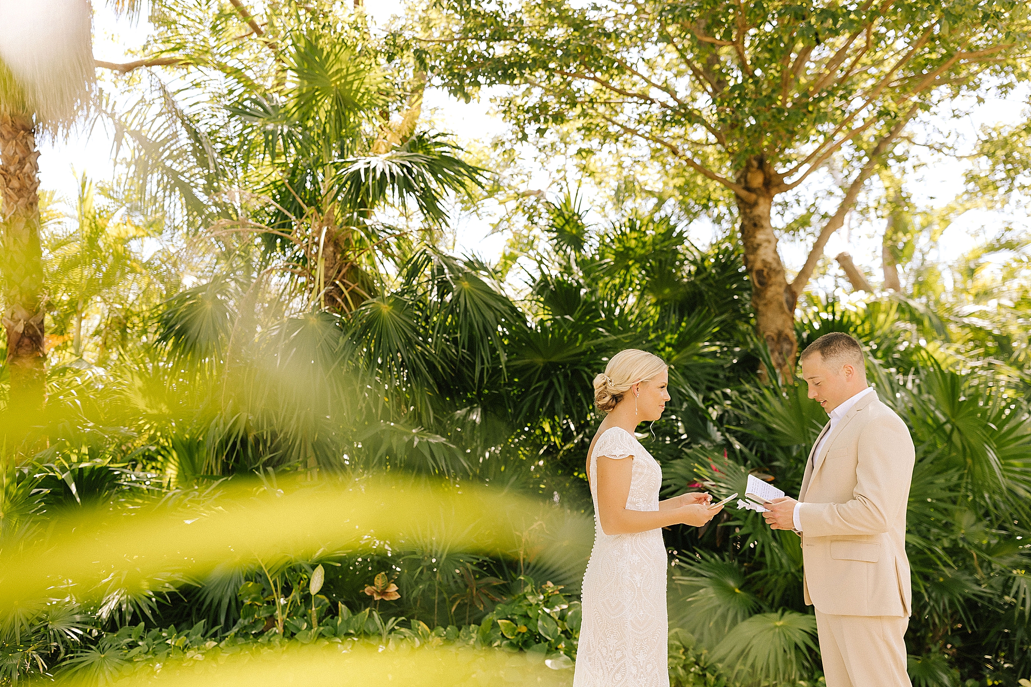 bride and groom read personal vows during first look before Playa Del Carmen Destination Wedding