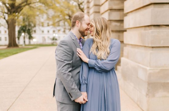 Engaged Couple in front of the capital building in Raleigh, NC