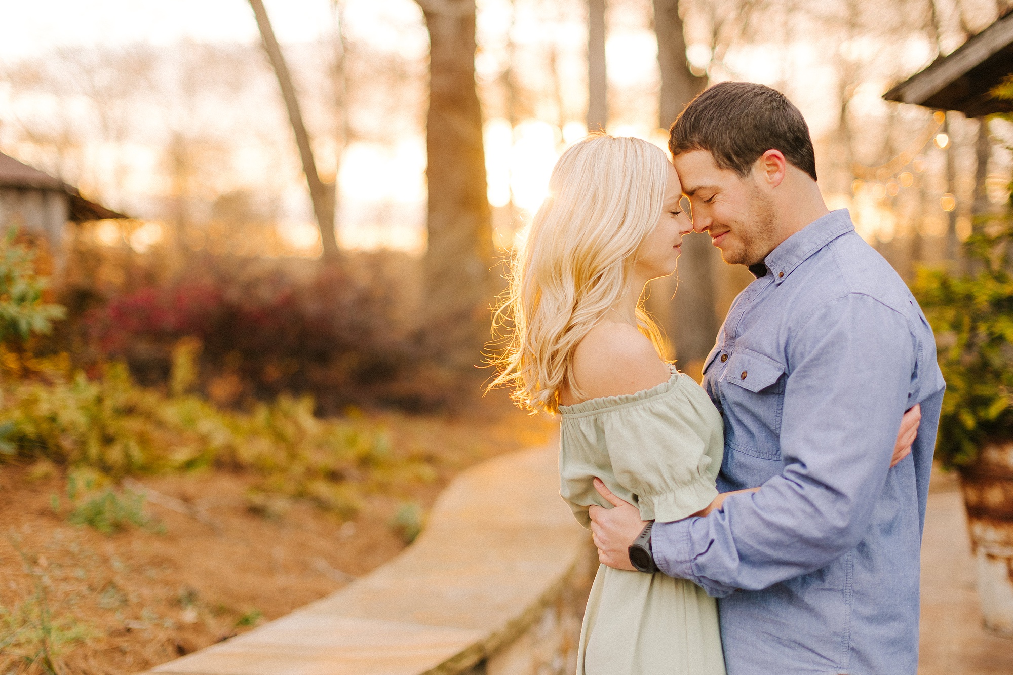 bride and groom pose at sunset during Summerfield Farms engagement photos