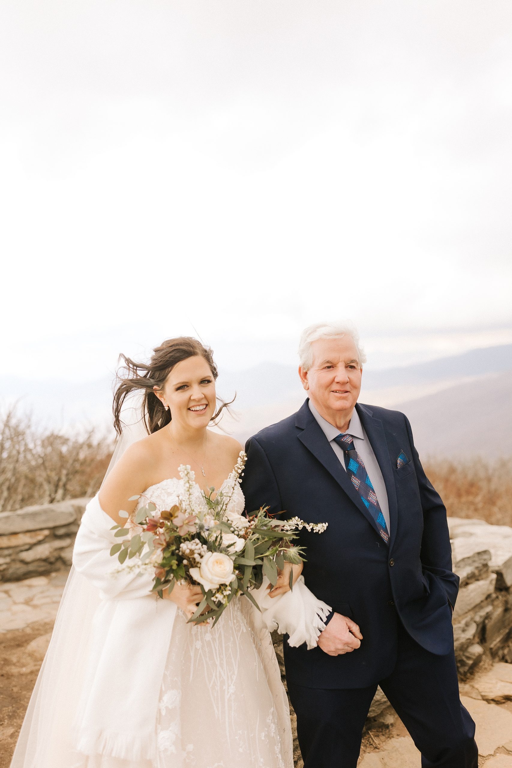 bride walks with father to ceremony