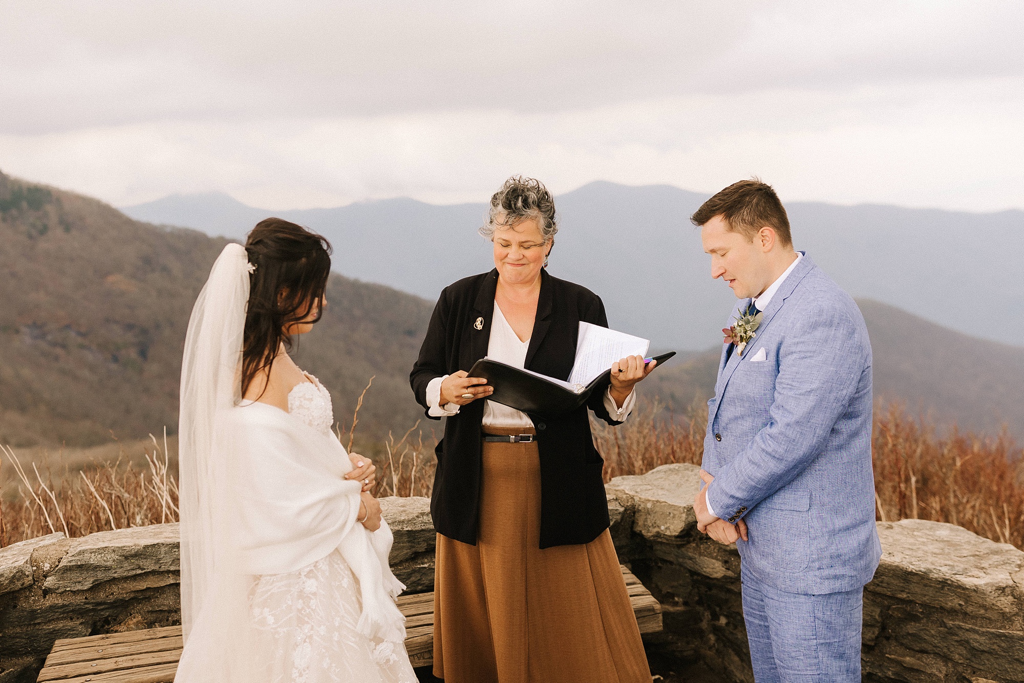 newlyweds exchange vows during Asheville Elopement at Craggy Pinnacle