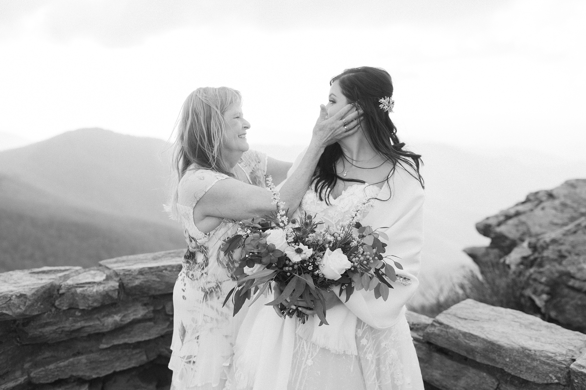 mother tips tears away off bride's face during elopement ceremony 