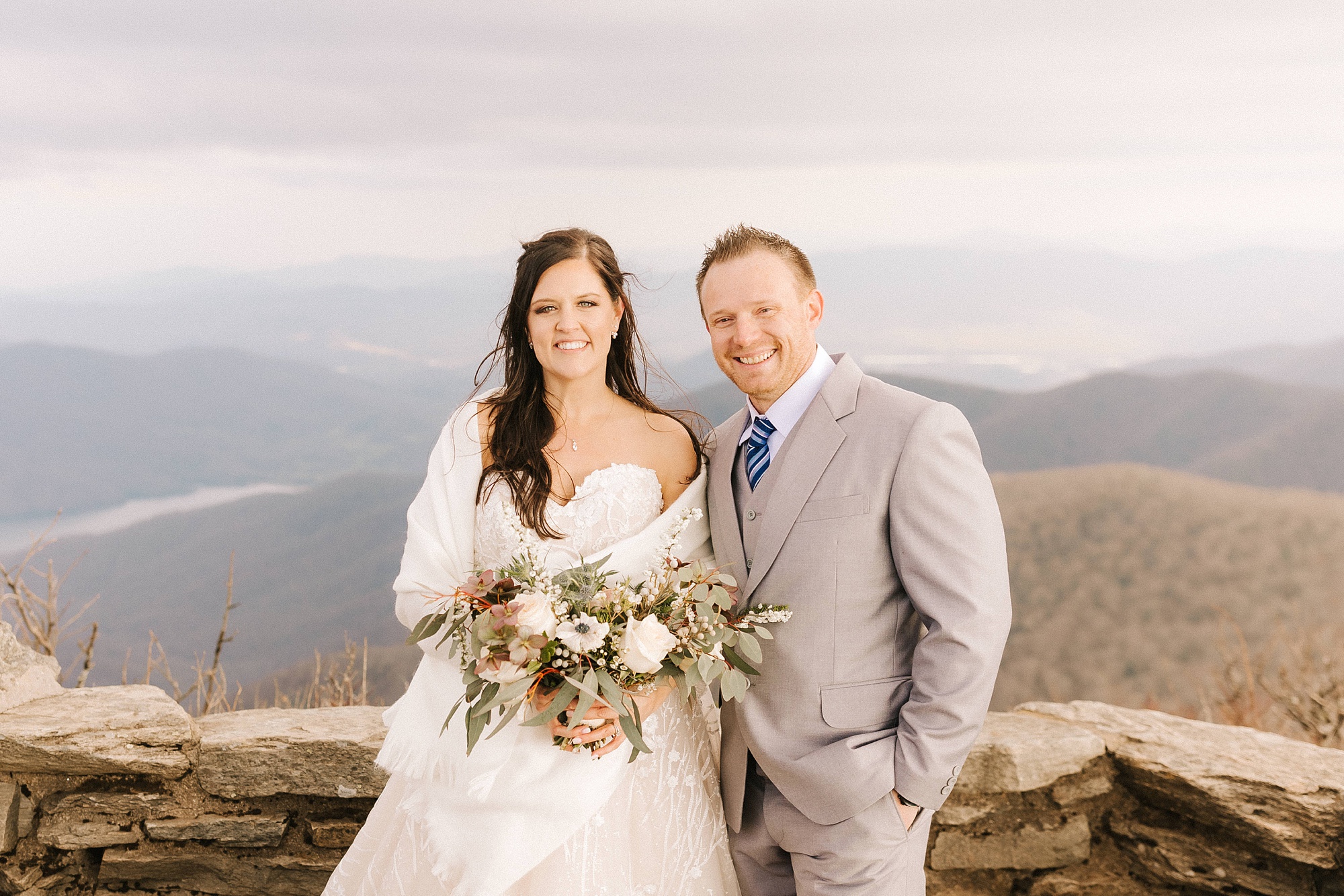 bride poses with brother-in-law after Asheville Elopement at Craggy Pinnacle