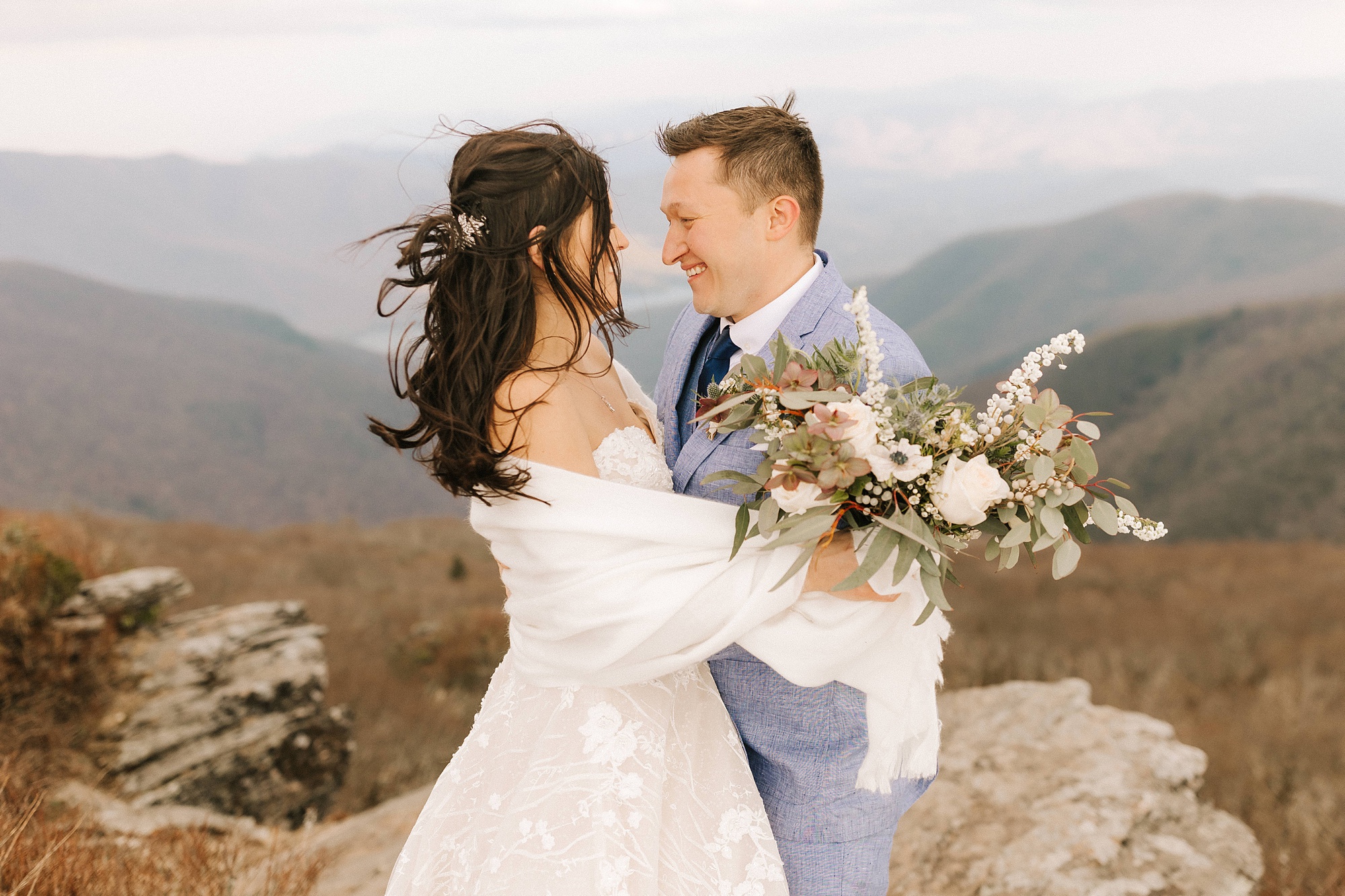 newlyweds look at each other during Asheville Elopement at Craggy Pinnacle