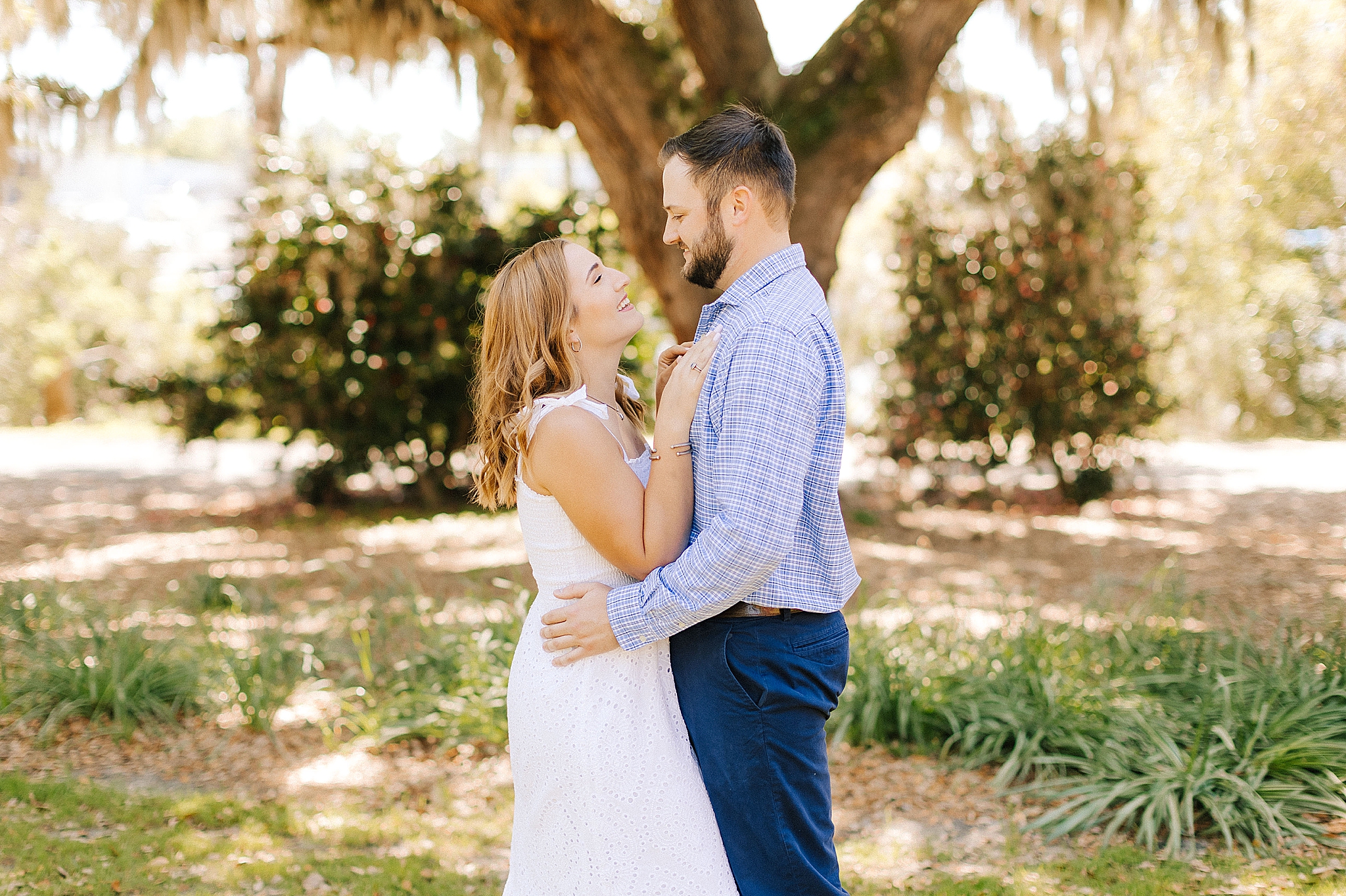 bride looks up at groom during Wilmington engagement session