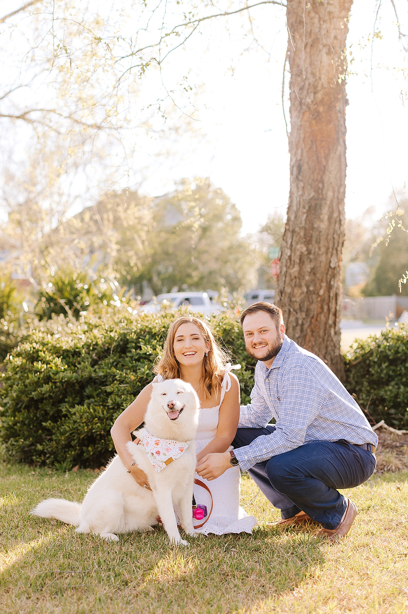 bride and groom pose with dog in Wilmington NC