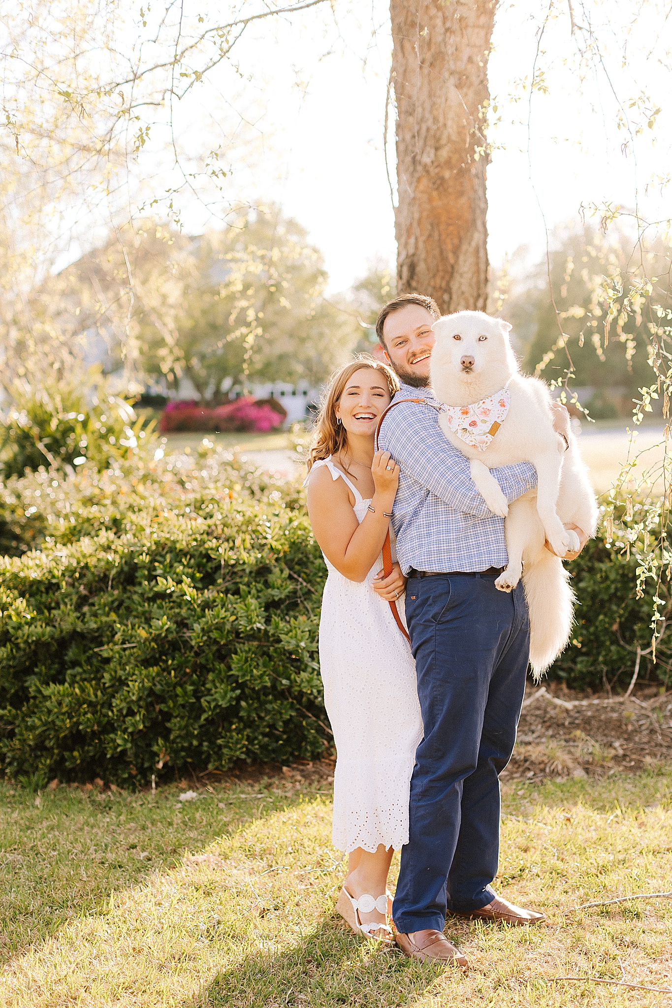 engaged couple hugs dog during Wilmington engagement session