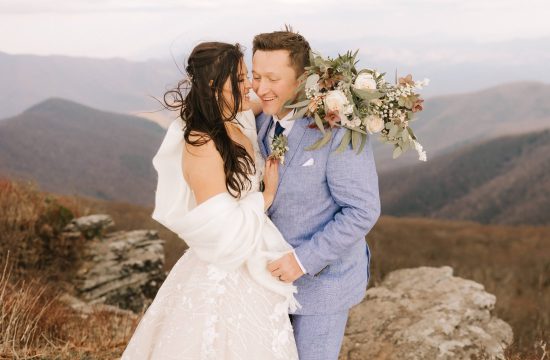 bride and groom laugh together at Craggy Pinnacle in Asheville, NC