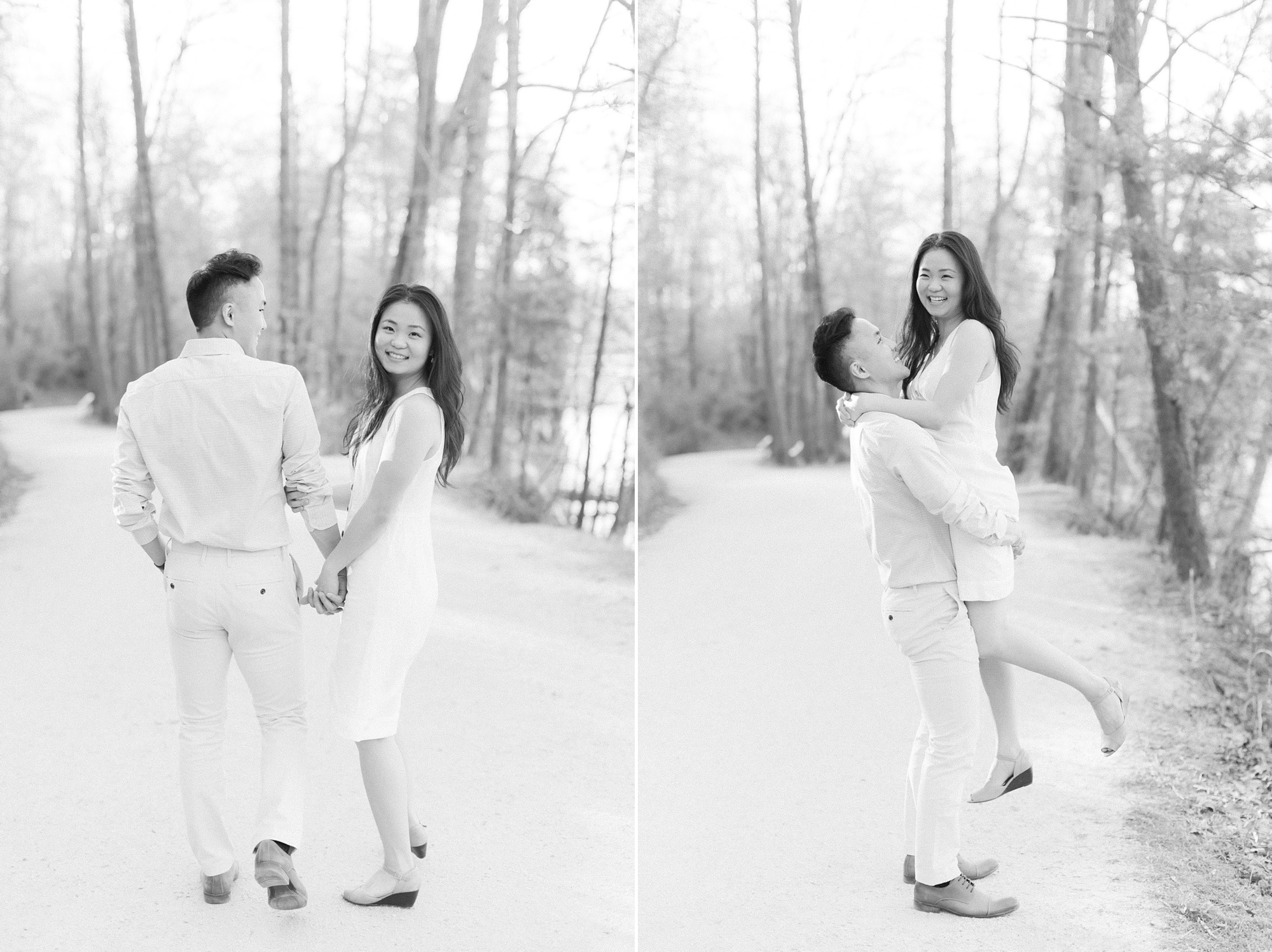 groom lifts bride during Salem Lake engagement portraits on pathway 