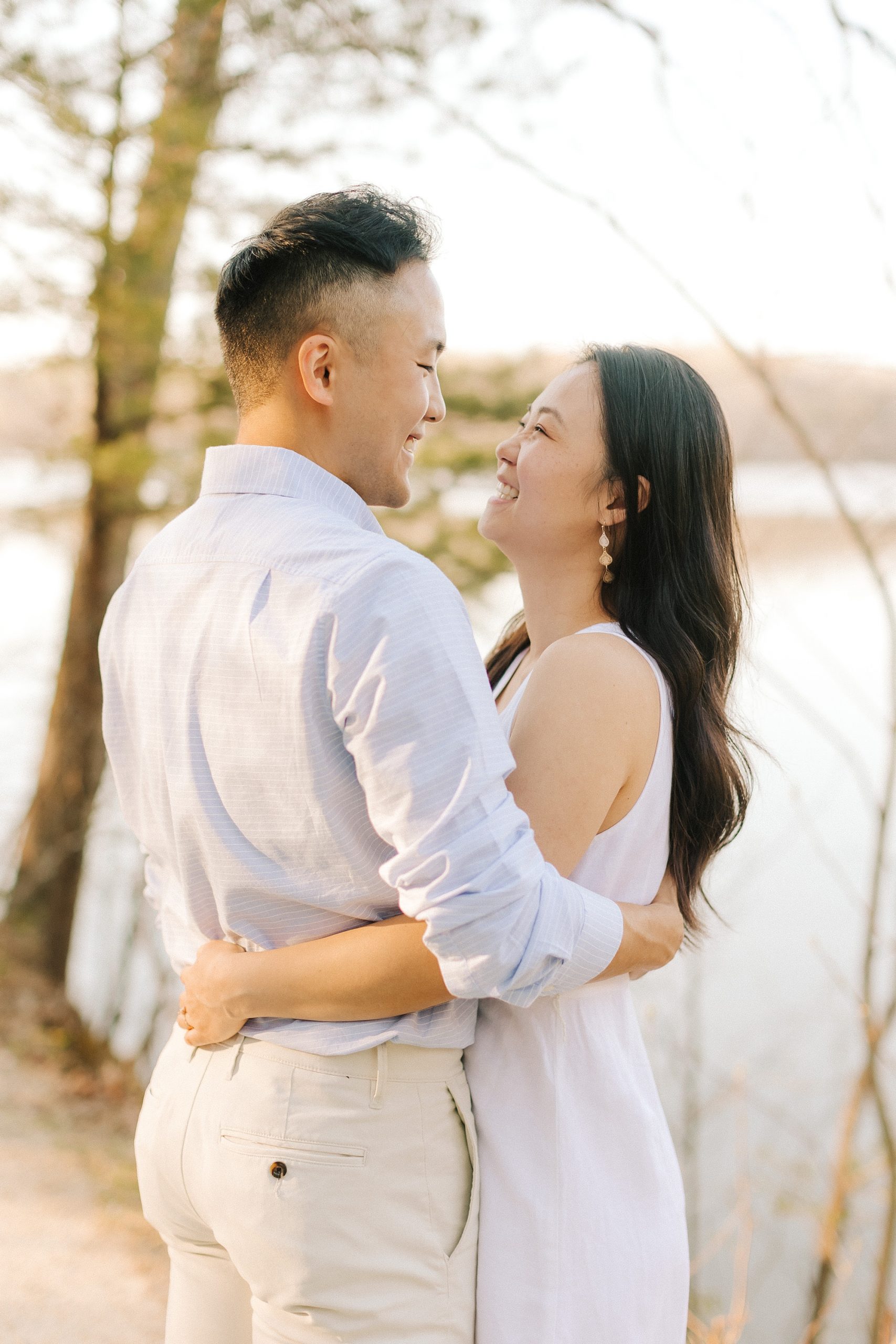 bride and groom hug looking at each other during NC engagement photos