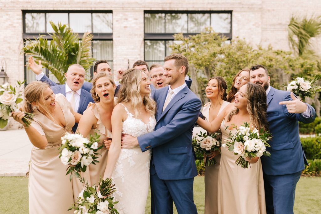 couple with their wedding party having fun at a Wrightsville Manor Wedding