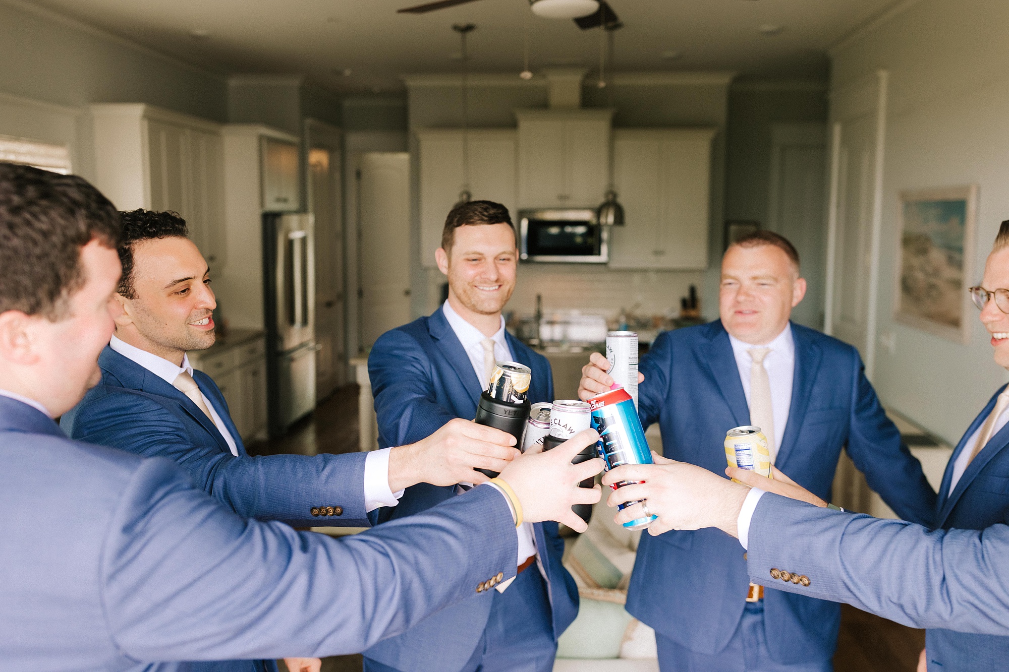 groomsmen toast before wedding photos
