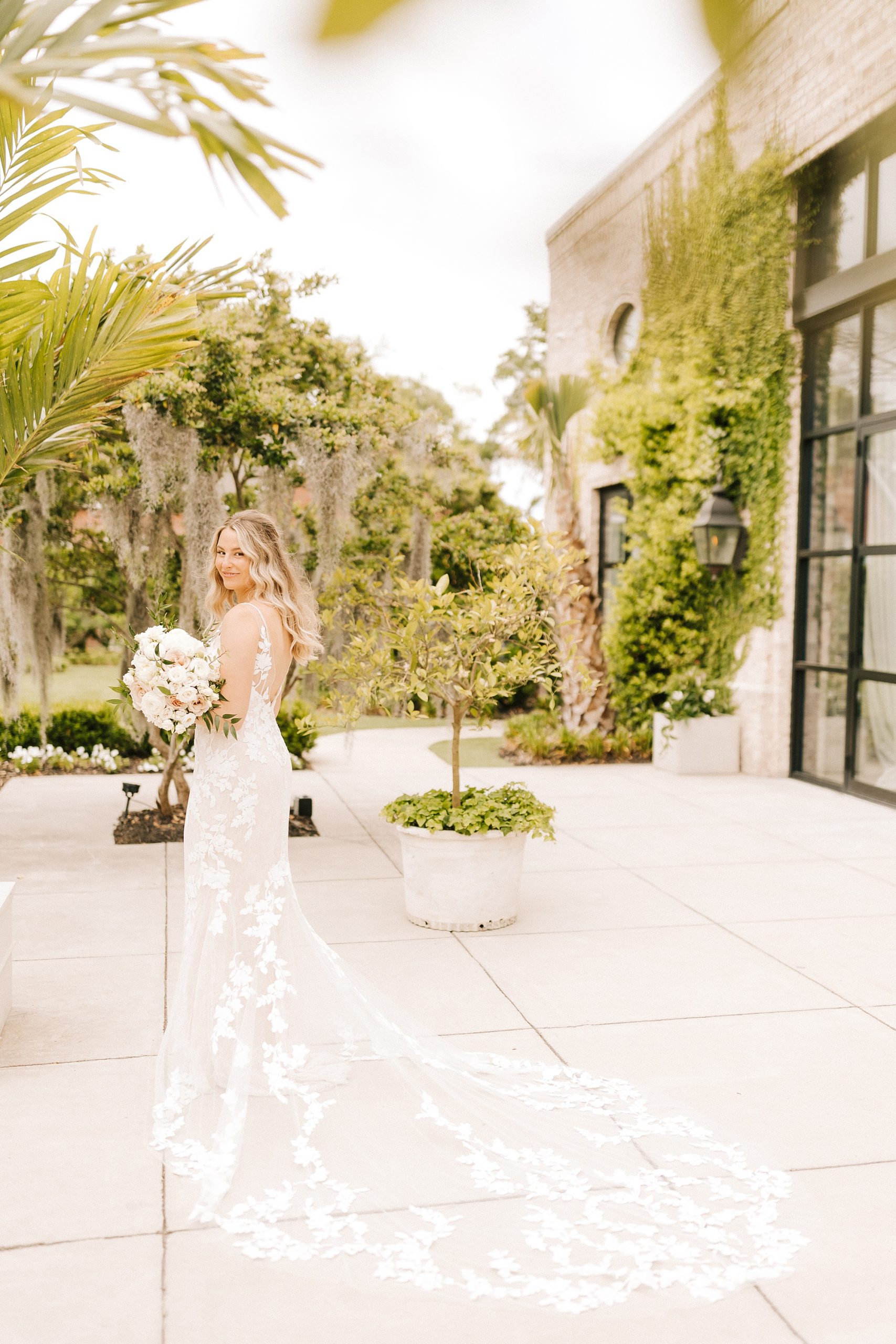 classic bridal portrait with bride looking over her shoulder at Wrightsville Manor